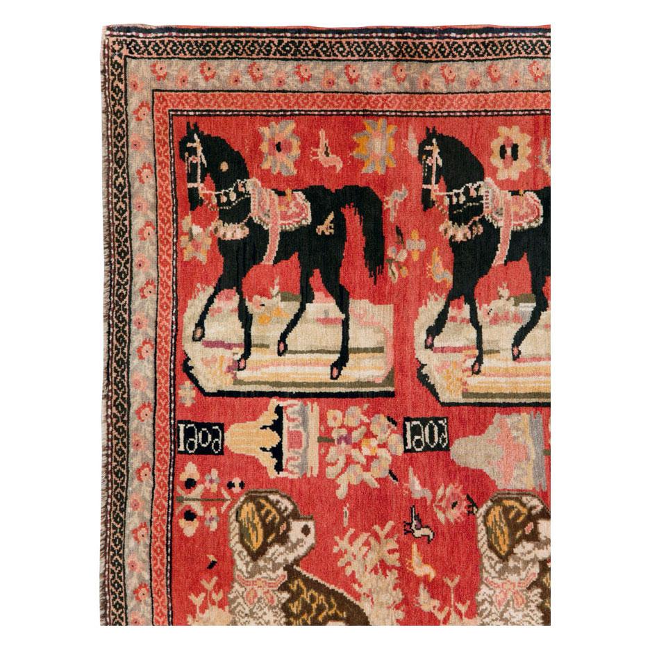An antique Caucasian 'Atly Itli (horse and dog)' Karabagh pictorial accent rug handmade during the early 20th century.

Measures: 4' 4