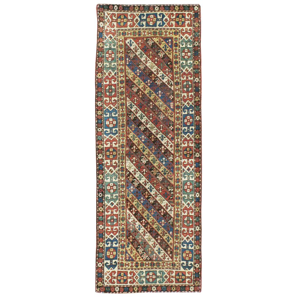 Early 20th Century Handmade Caucasian Kazak Runner with a Tribal Design For Sale