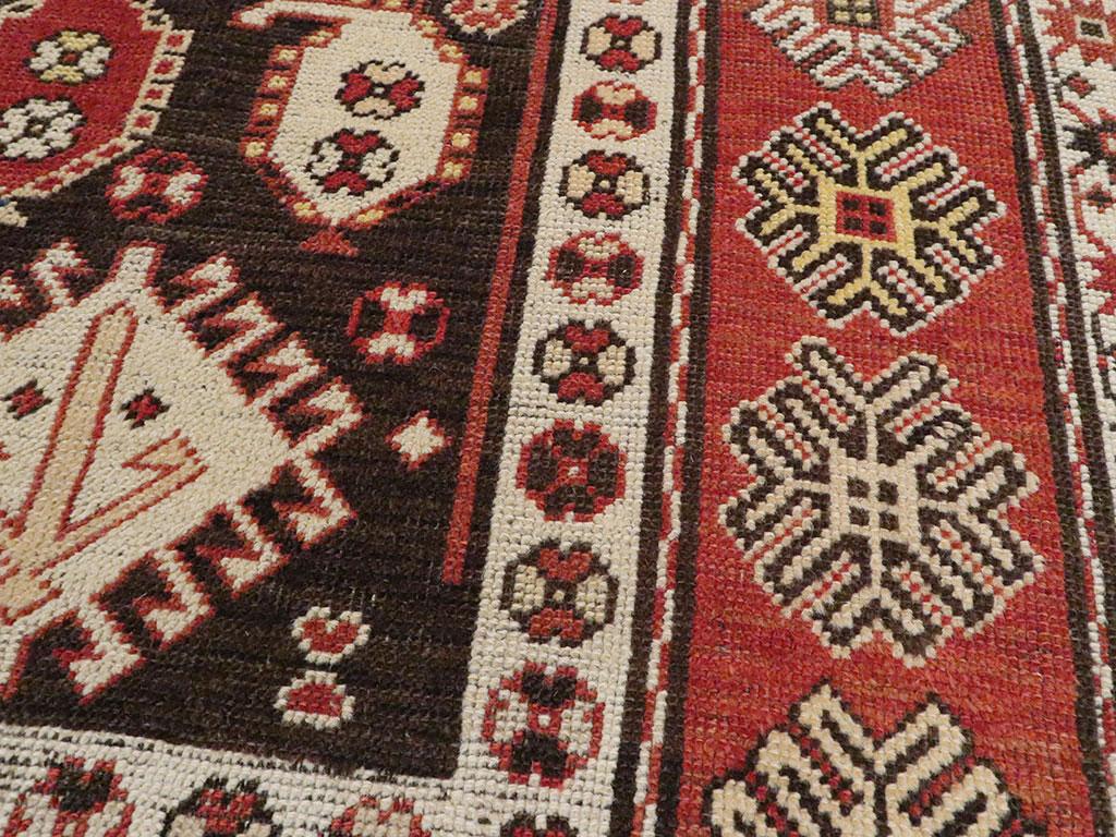 Rustic Early 20th Century Handmade Caucasian Kazak Throw Rug For Sale