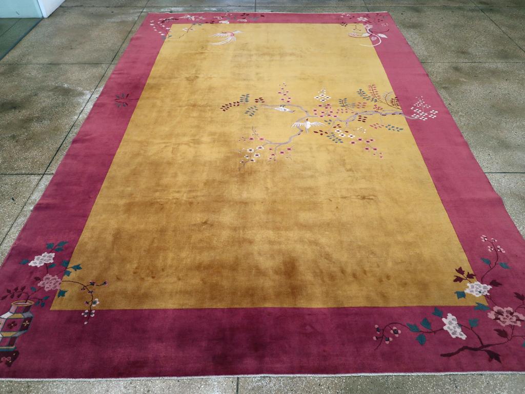 An antique Chinese Art Deco room size carpet handmade during the early 20th century.

Measures: 10' 1