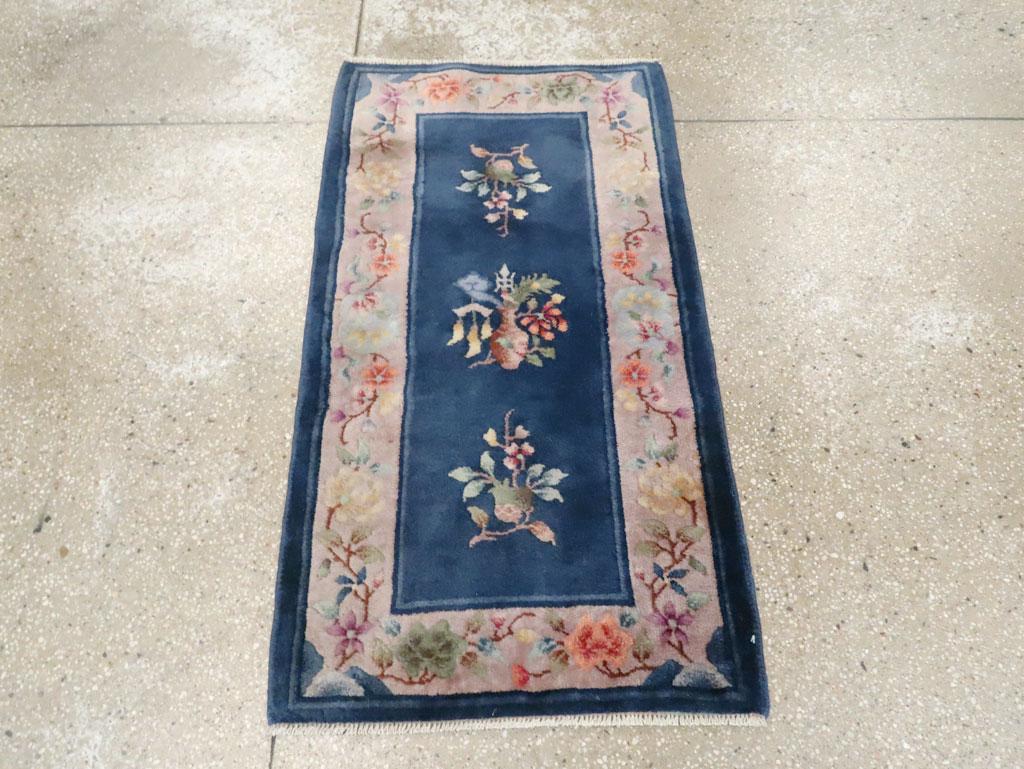 An antique Chinese Art Deco throw rug handmade during the early 20th century.

Measures: 2' 0