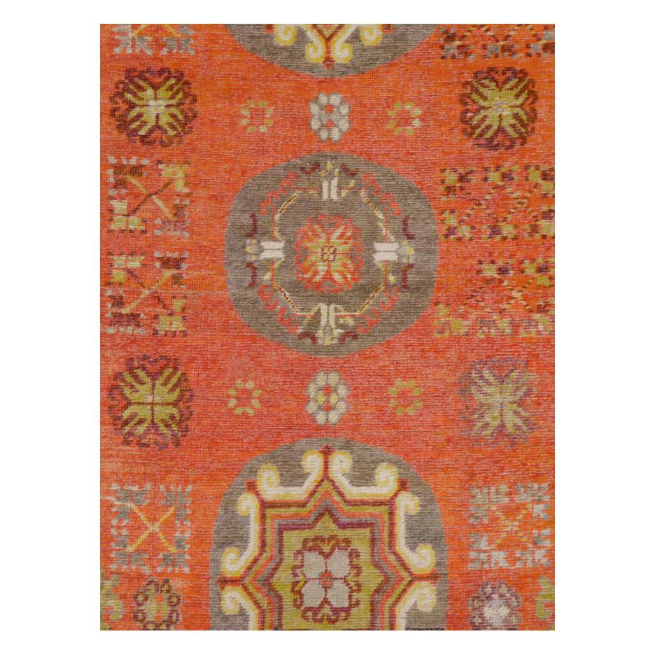 An antique East Turkestan Khotan accent rug handmade during the early 20th century.

Measures: 4' 9
