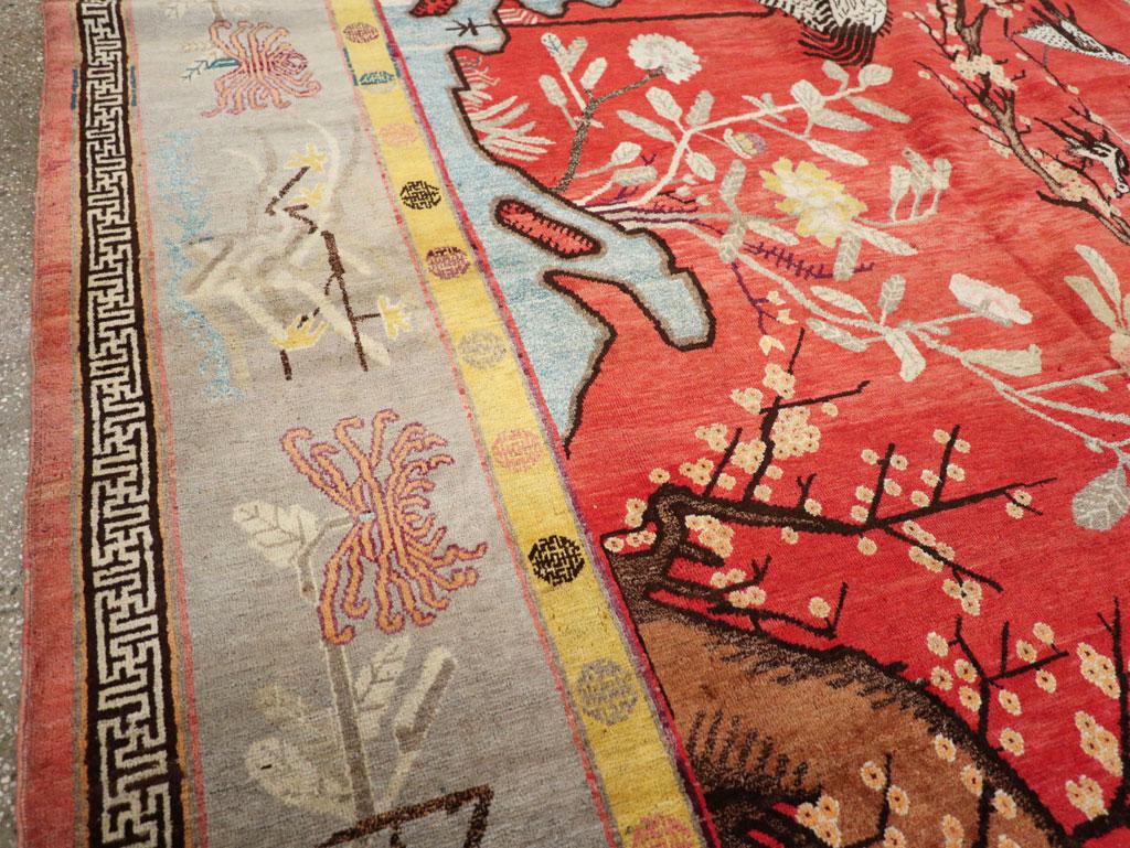 East Turkestani Early 20th Century Handmade East Turkestan Pictorial Khotan Room Size Carpet For Sale