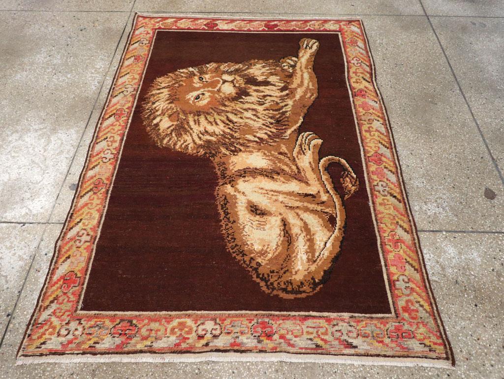 East Turkestani Early 20th Century Handmade East Turkestan Pictorial Lion Khotan Accent Rug For Sale