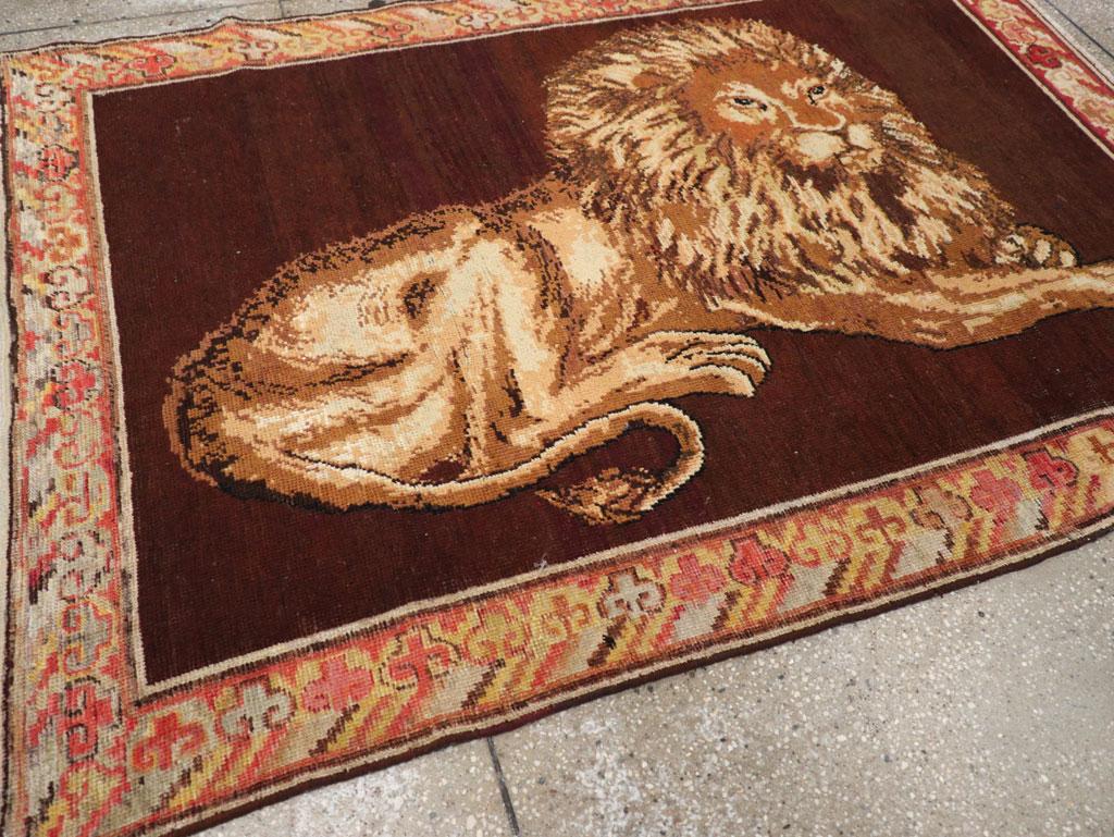 Hand-Knotted Early 20th Century Handmade East Turkestan Pictorial Lion Khotan Accent Rug For Sale