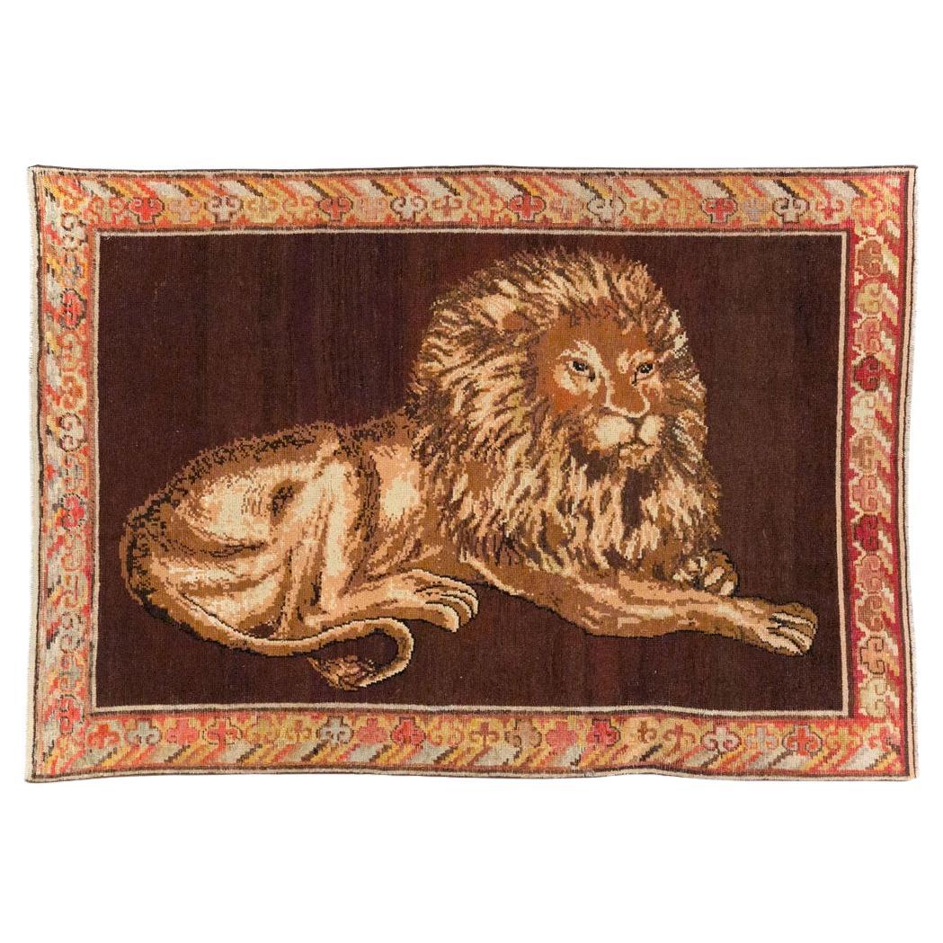 Early 20th Century Handmade East Turkestan Pictorial Lion Khotan Accent Rug For Sale