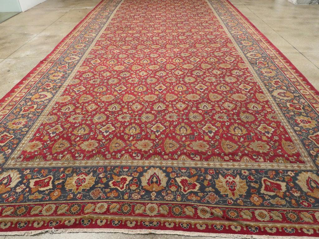 A long & narrow antique Indian Lahore oversize carpet handmade during the early 20th century.

Measures: 11' 6