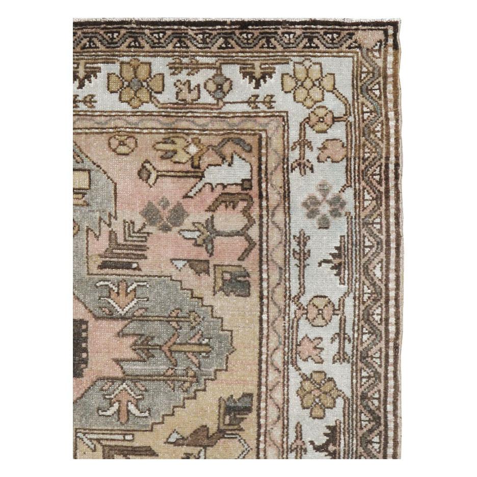 An antique Northwest Persian accent rug handmade during the early 20th century.

Measures: 4' 5