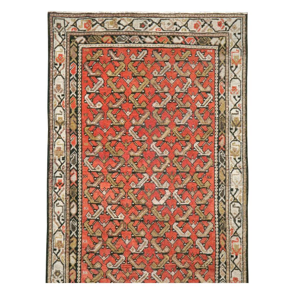 An antique northwest Persian rug in runner format handmade during the early 20th century.

Measures: 2' 8