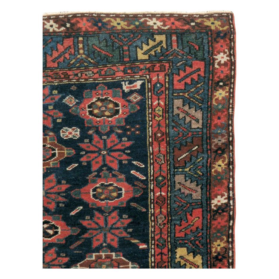 Rustic Early 20th Century Handmade Persian Accent Rug in Dark Blue, Green and Light Red For Sale