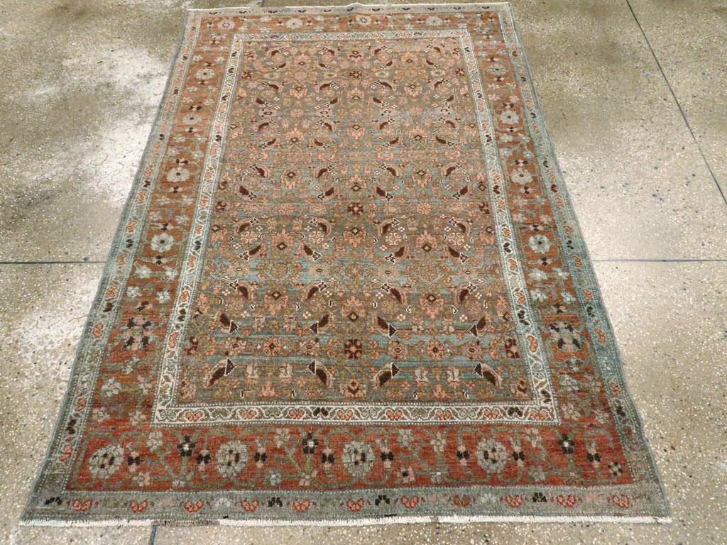 An antique Persian Bidjar accent rug handmade during the early 20th century.

Measures: 4' 2
