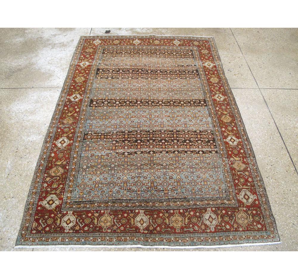 An antique Persian Bidjar accent rug handmade during the early 20th century.

Measures: 4' 4