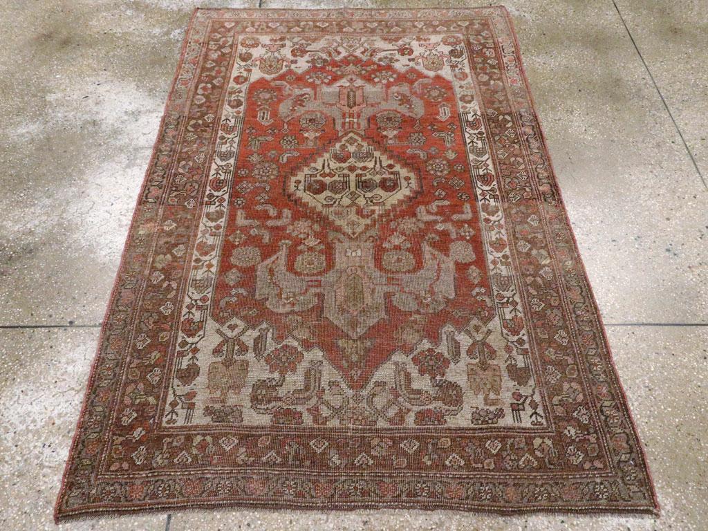 An antique Persian Bidjar accent rug handmade during the early 20th century.

Measures: 4' 1