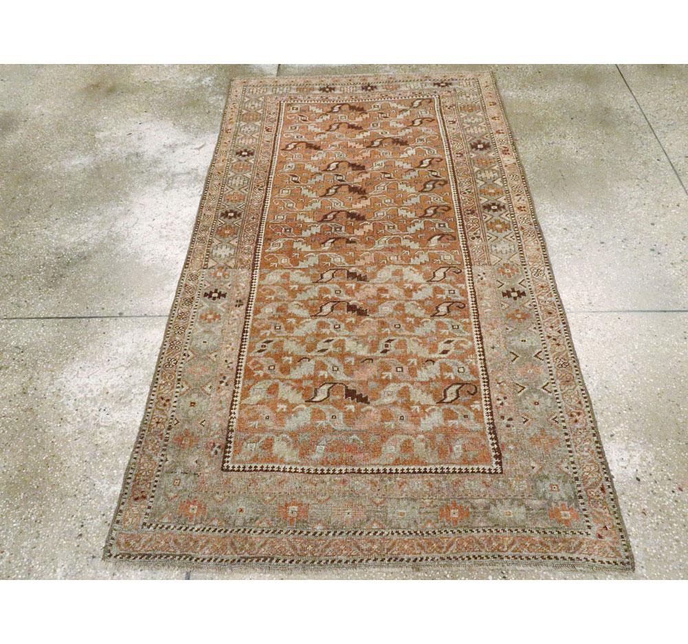 An antique Persian Bidjar throw rug handmade during the early 20th century.

Measures: 3' 8