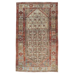 Alfombra persa de pelo de camello de principios del siglo XX hecha a mano