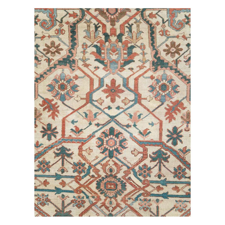 An antique Persian Heriz large room size carpet handmade during the early 20th century.

Measures: 9' 4