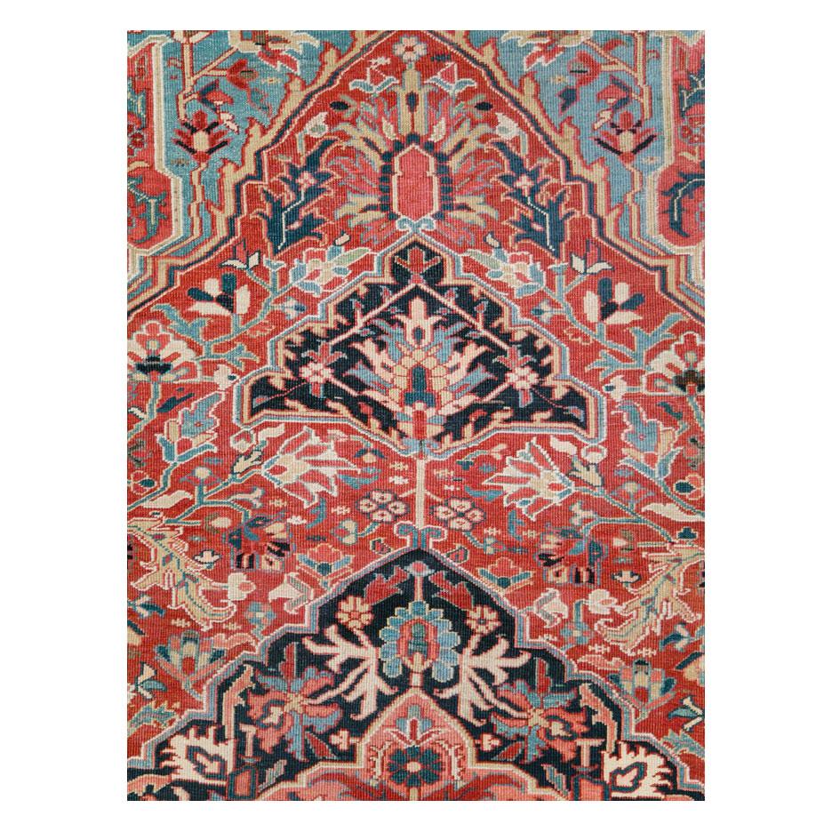 An antique Persian Heriz large room size carpet handmade during the early 20th century.

Measures: 11' 1
