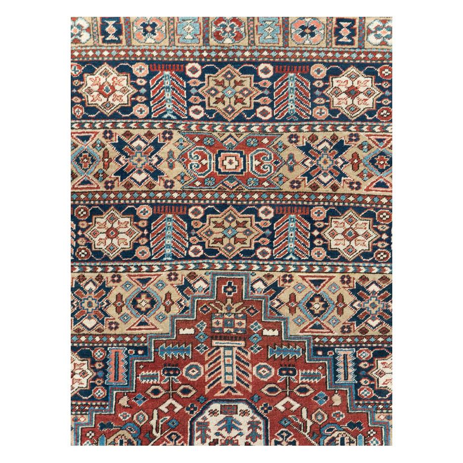 An antique Persian Heriz room size carpet handmade during the early 20th century.

Measures: 8' 2