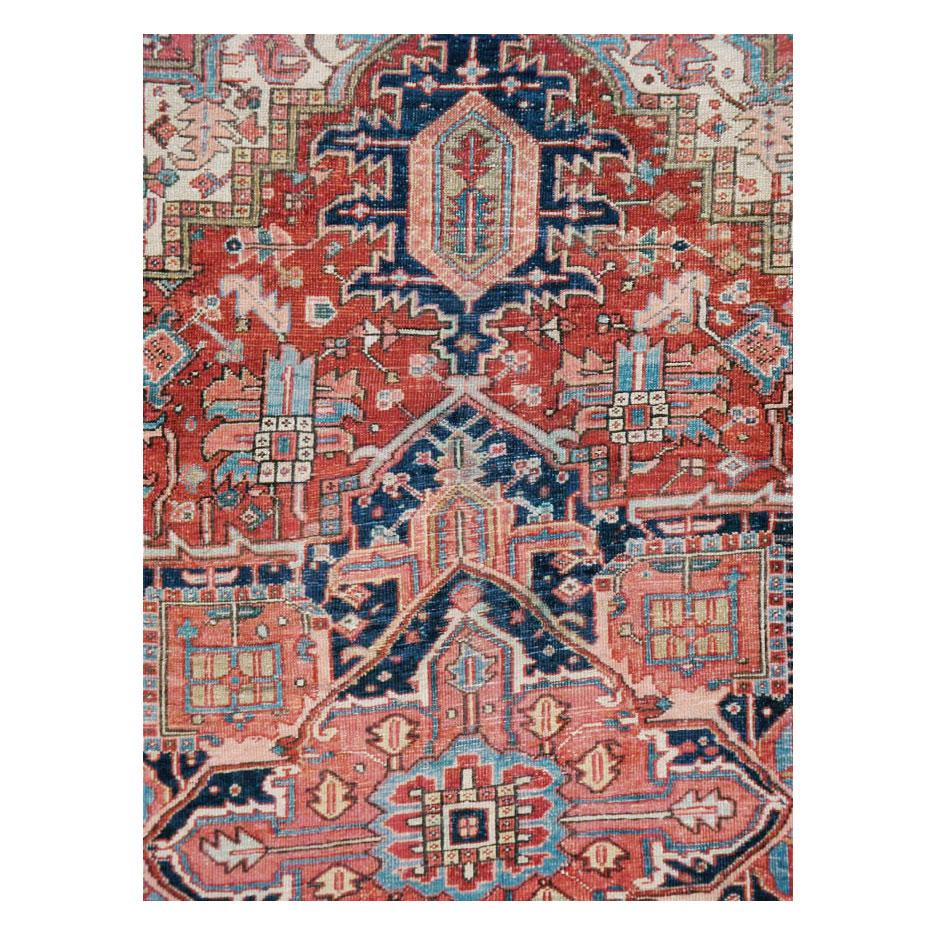 An antique Persian Heriz room size carpet handmade during the early 20th century.

Measures: 7' 7