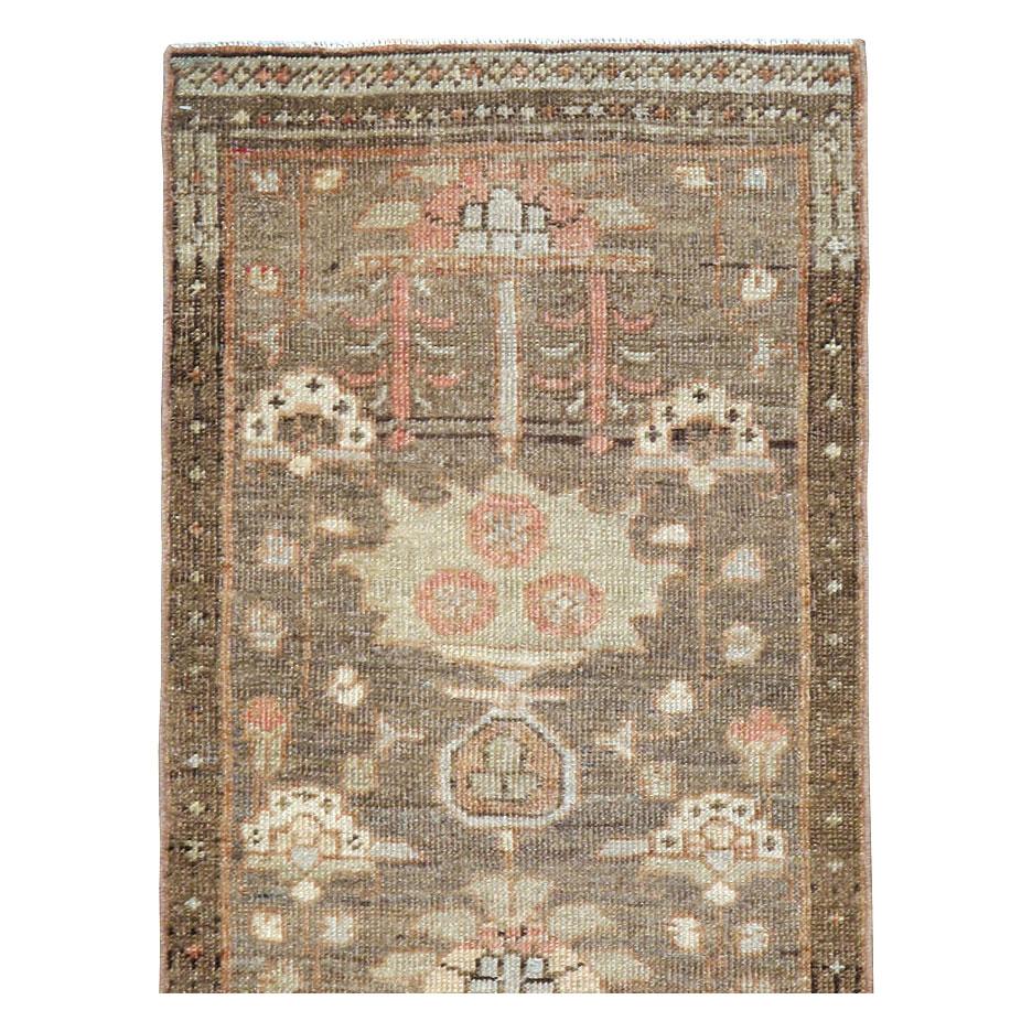 An antique Persian Heriz runner handmade during the early 20th century.