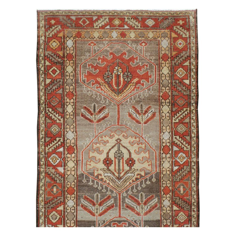 An antique Persian Heriz runner handmade during the early 20th century.

Measures: 3' 3