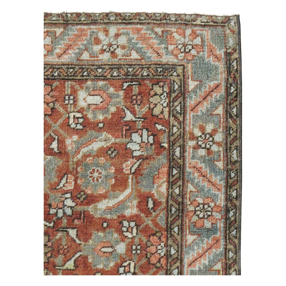 An antique Persian Heriz throw rug handmade during the early 20th century.

Measures: 3' 1