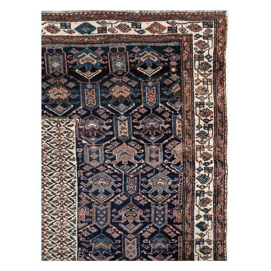 An antique Persian Kurdish accent rug handmade during the early 20th century.

Measures: 6'0