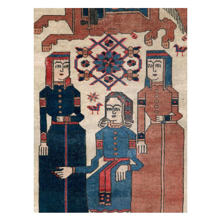 An antique Persian Kurd pictorial accent rug handmade during the early 20th century.

Measures: 4' 2