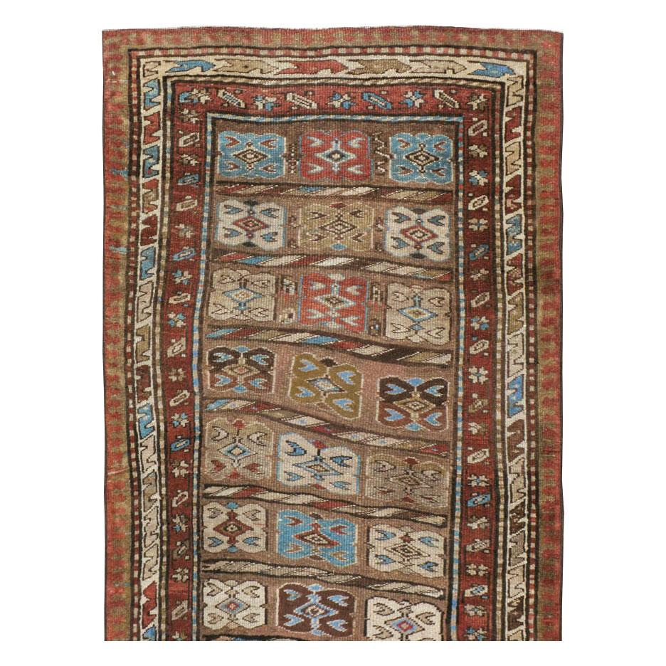 An antique Persian Kurd rug in runner format handmade during the early 20th century.

Measures: 3' 5