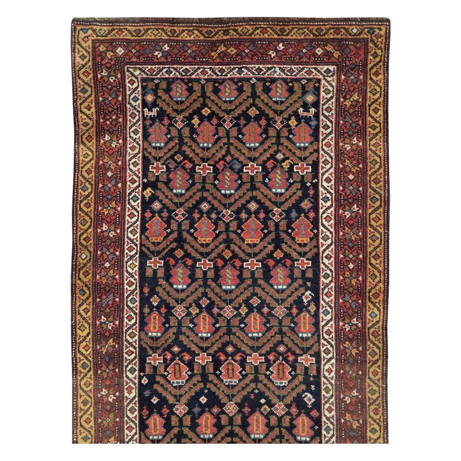An antique Persian Kurd runner handmade during the mid-20th century.

Measures: 3' 2