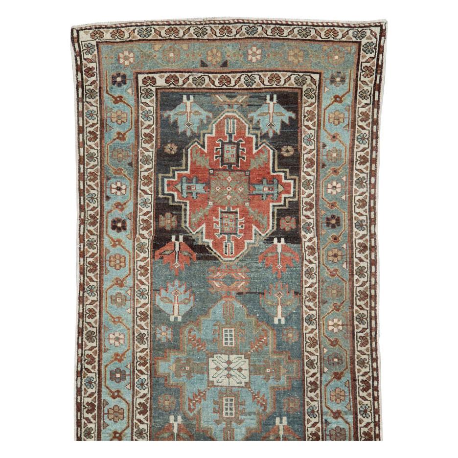 An antique Persian Kurd runner handmade during the early 20th century.

Measures: 3' 2