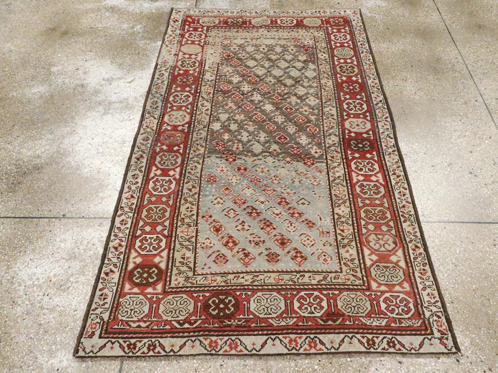 An antique Persian Kurd small accent rug handmade during the early 20th century.

Measures: 3' 9