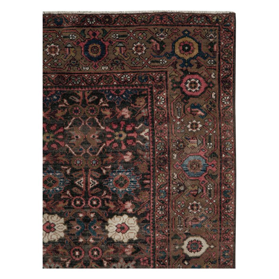 An antique Persian Mahal accent rug in long and narrow gallery format handmade during the early 20th century.

Measures: 5'2