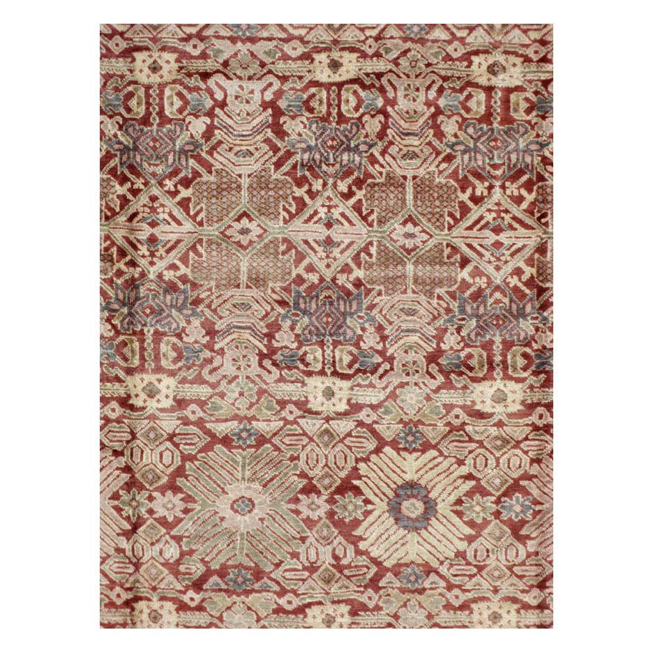An antique Persian Mahal room size carpet handmade during the early 20th century.

Measures: 9' 11