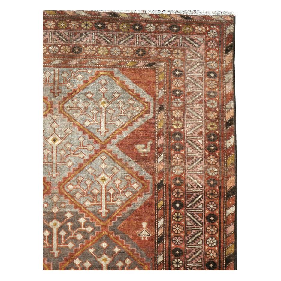 An antique Persian Malayer accent rug handmade during the early 20th century.

Measures: 4' 0