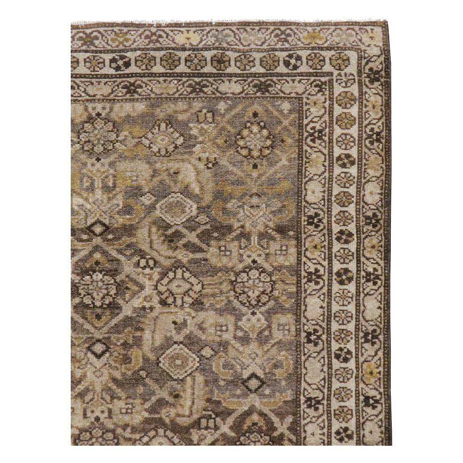 An antique Persian Malayer accent rug handmade during the early 20th century.

Measures: 3' 11