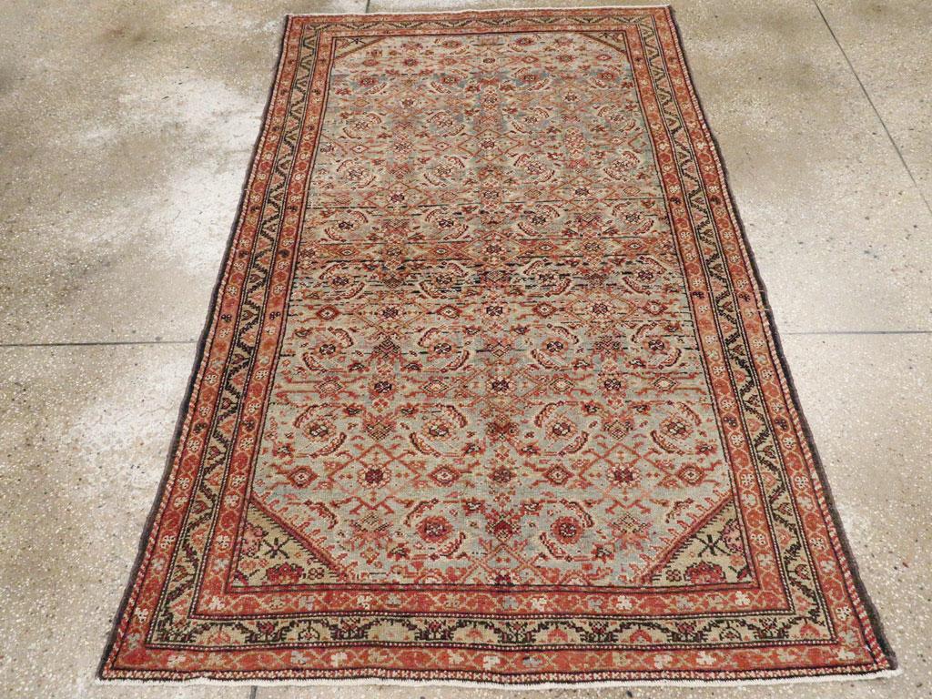 An antique Persian Malayer accent rug handmade during the early 20th century.

Measures: 4' 1
