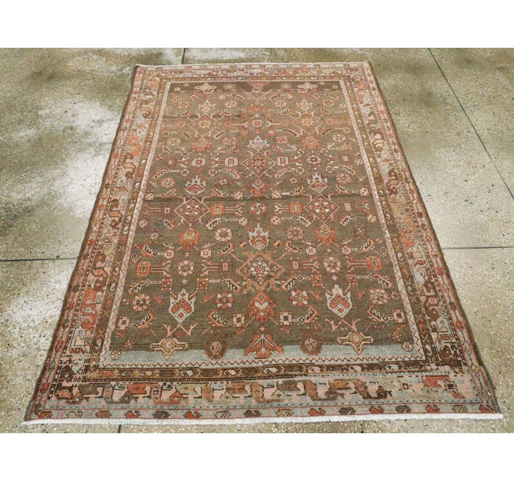 An antique Persian Malayer accent rug handmade during the early 20th century.

Measures: 4' 4