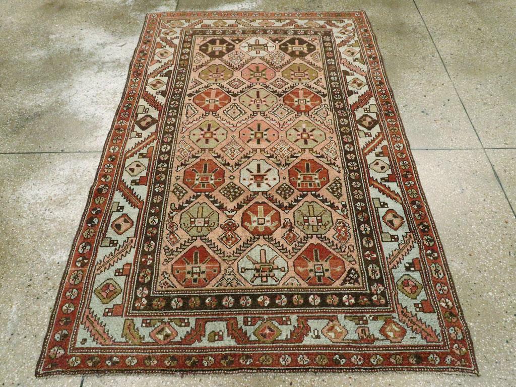 An antique Persian Malayer accent rug handmade during the early 20th century.

Measures: 4' 3