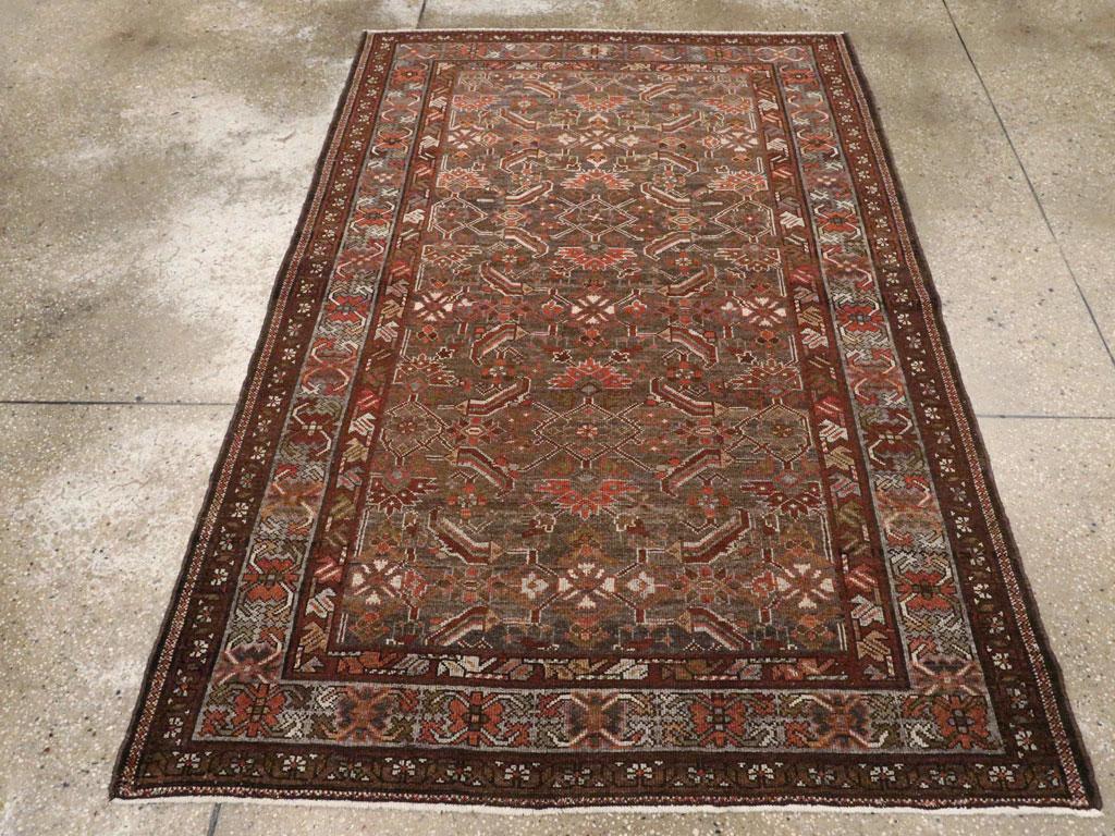 An antique Persian Malayer accent rug handmade during the early 20th century.

Measures: 4' 3