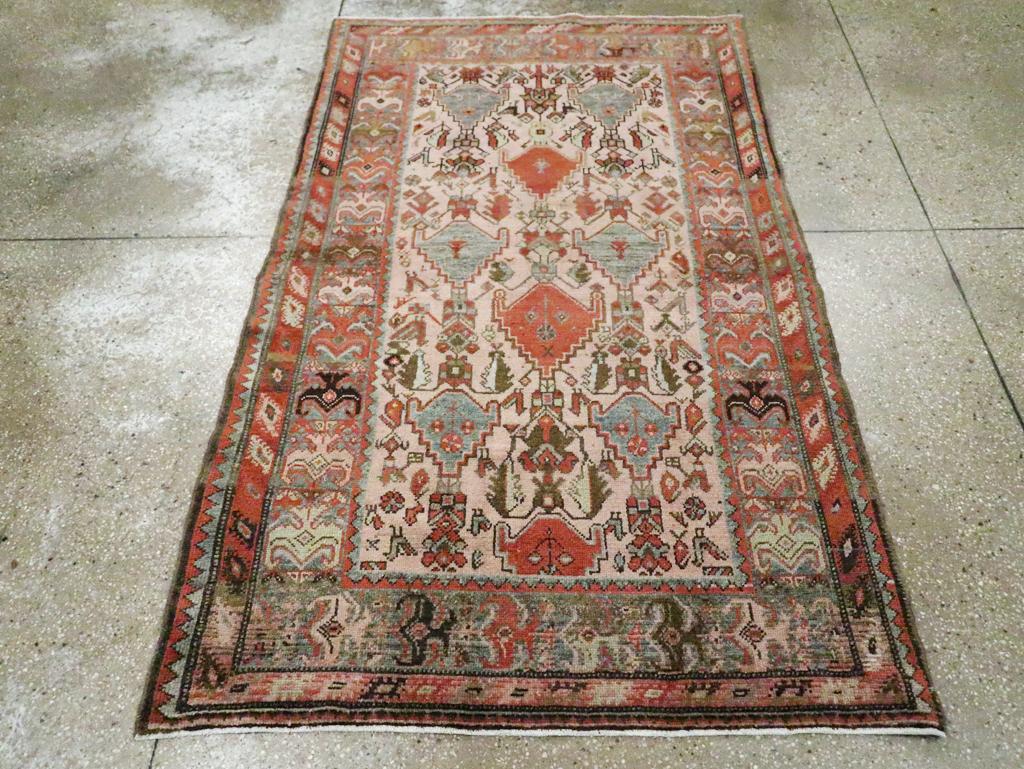 An antique Persian Malayer accent rug handmade during the early 20th century.

Measures: 3' 10
