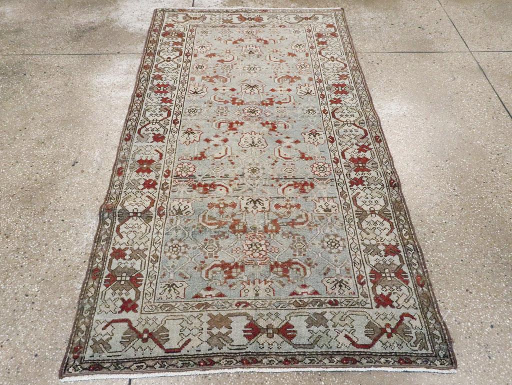 An antique Persian Malayer accent rug handmade during the early 20th century.

Measures: 3' 6