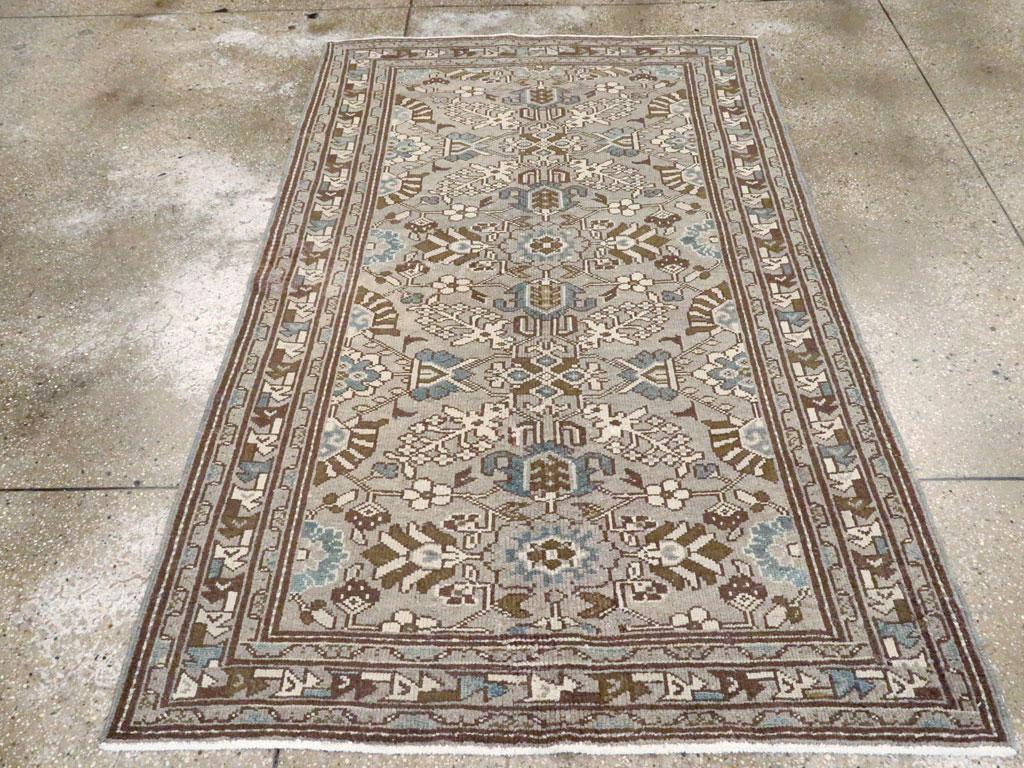 An antique Persian Malayer accent rug handmade during the early 20th century.

Measures: 4' 2