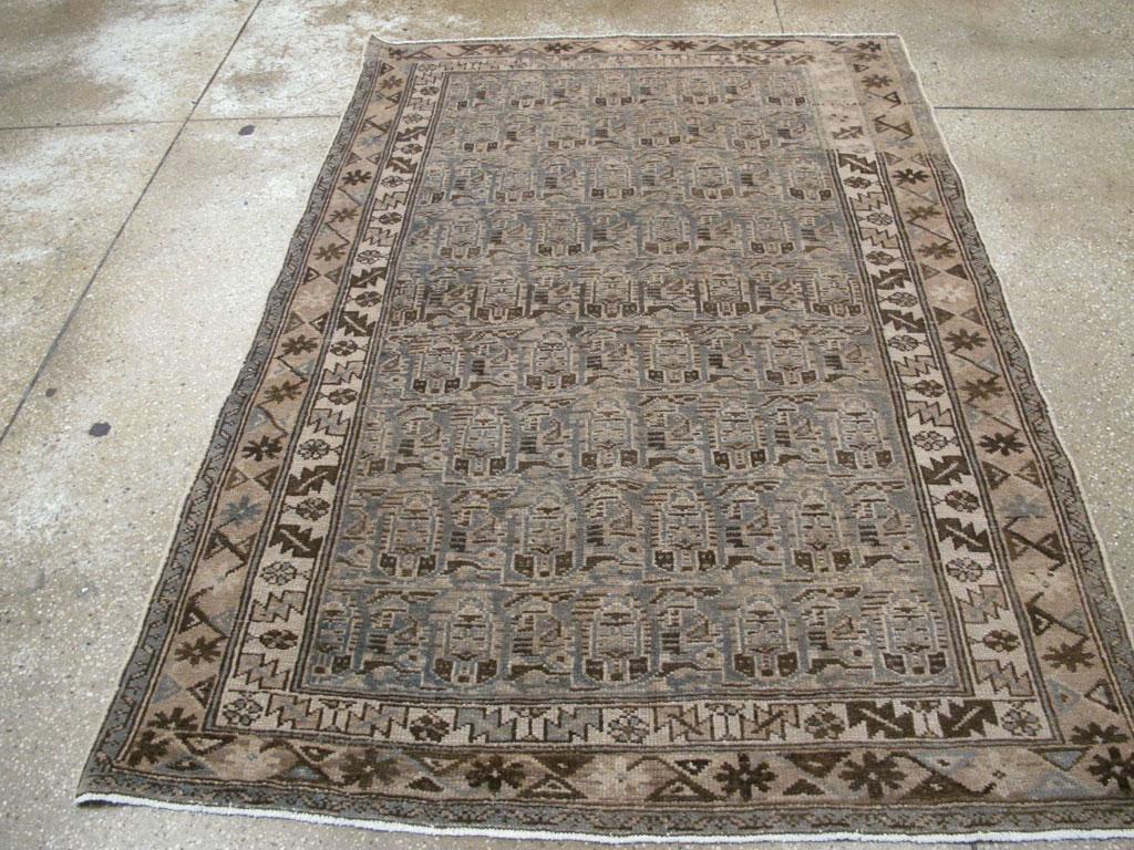 An antique Persian Malayer accent rug handmade during the early 20th century.

Measures: 4' 5