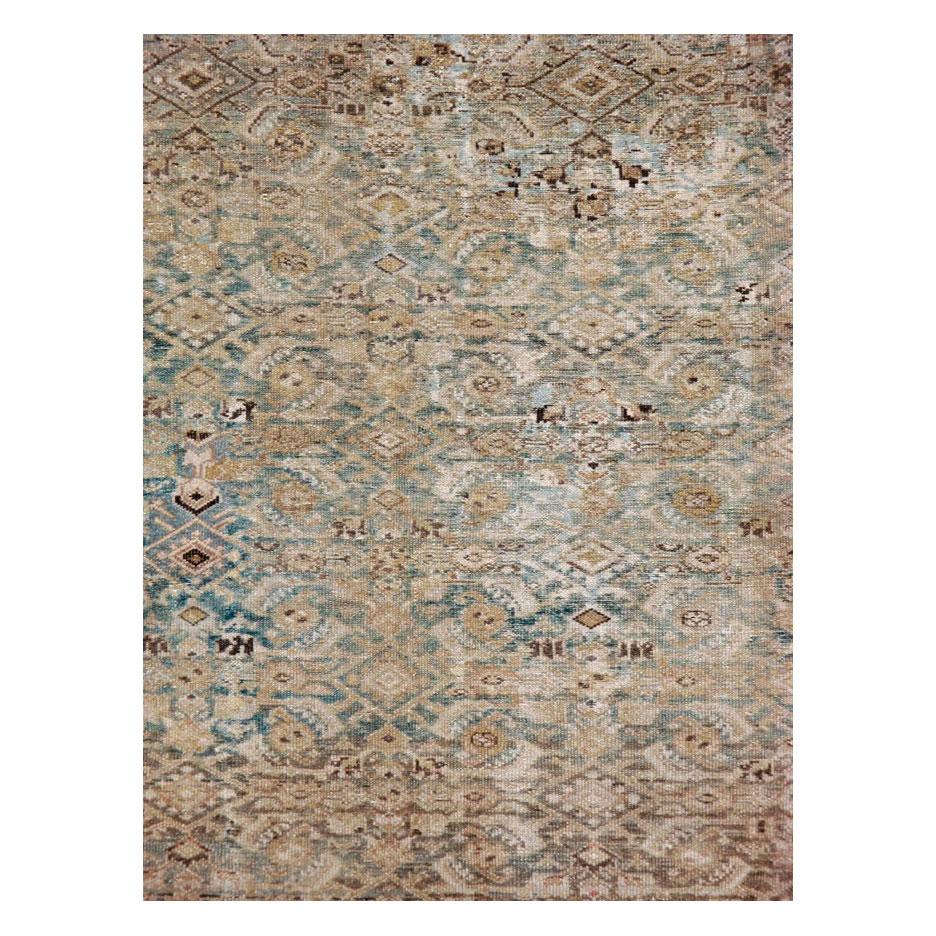 An antique Persian Malayer accent rug handmade during the mid-20th century with a classic 