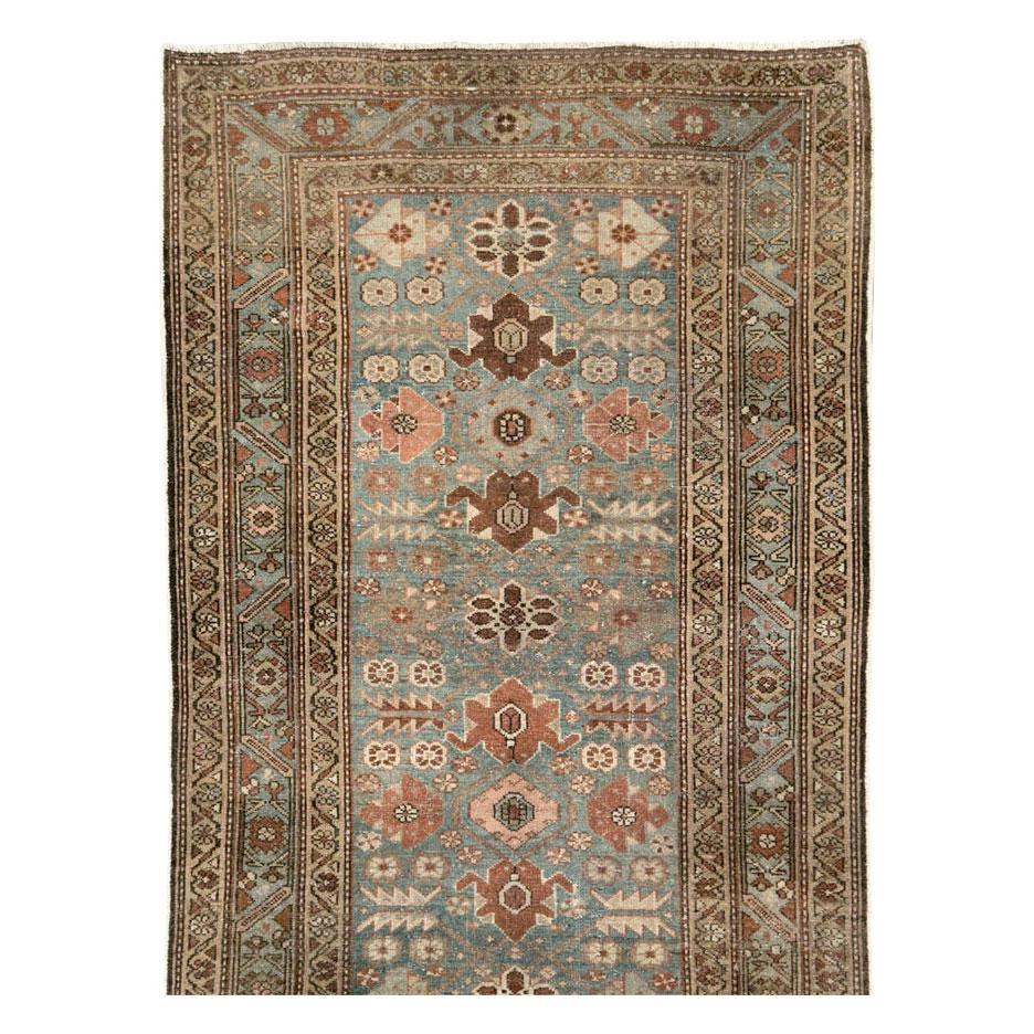 An antique Persian Malayer long runner handmade during the early 20th century.

Measures: 3' 3