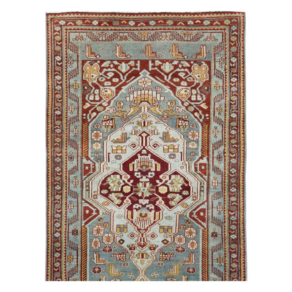 An antique Persian Malayer long runner handmade during the early 20th century.

Measures: 3' 10