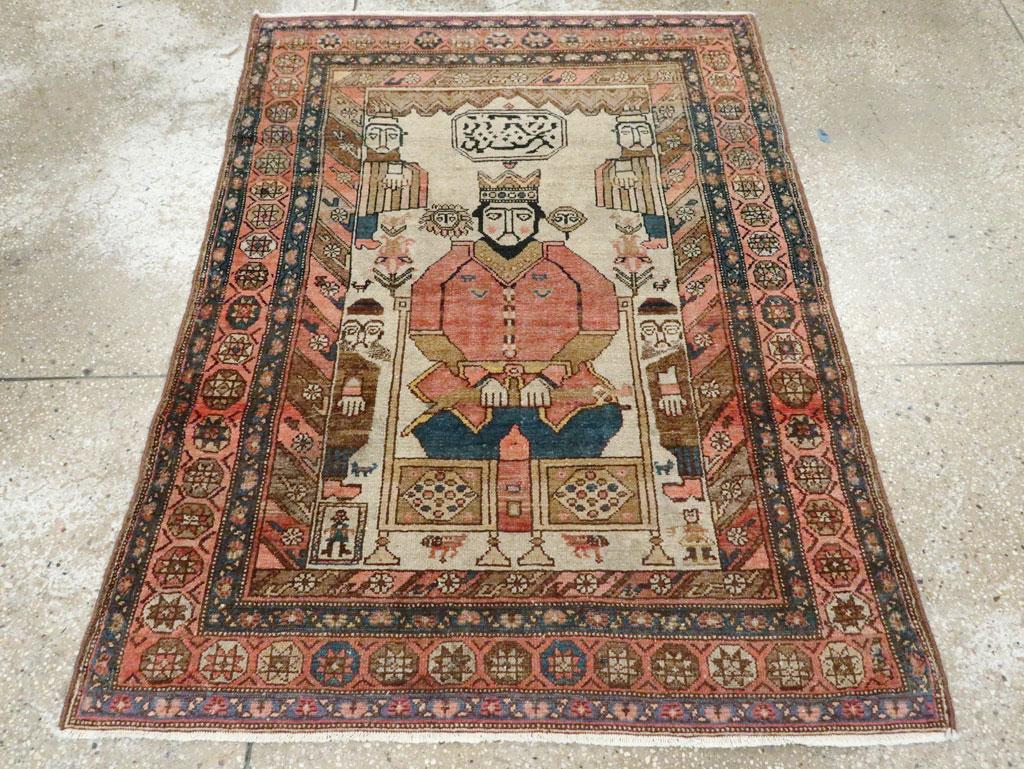 An antique Persian Malayer pictorial throw rug handmade during the early 20th century.

Measures: 3' 6