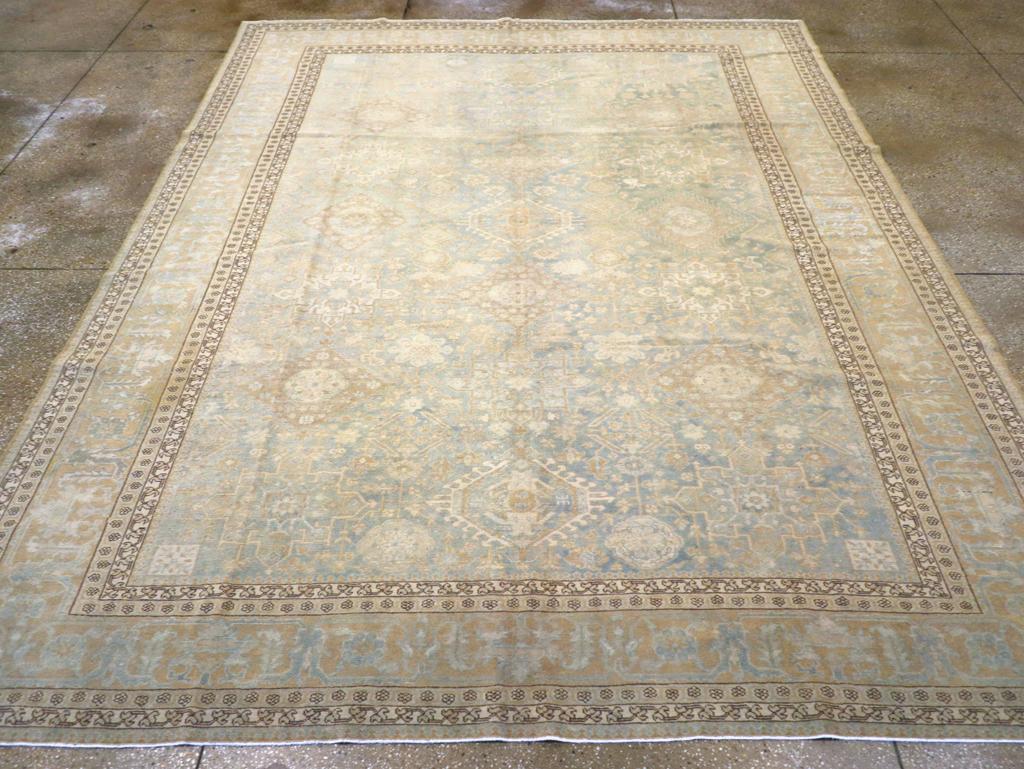An antique Persian Malayer room size carpet handmade during the early 20th century in the Persian Karajeh style.

Measures: 9' 8