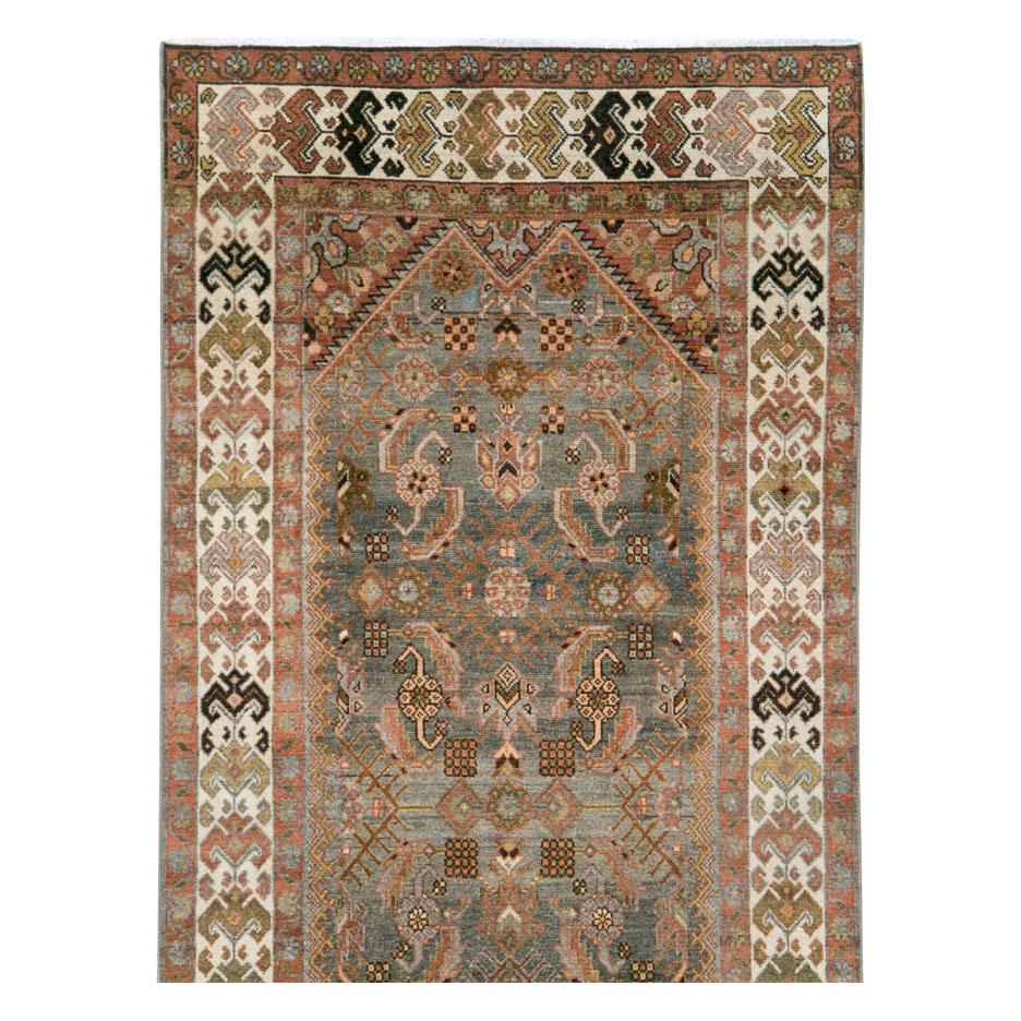 An antique Persian Malayer rug in runner format handmade during the early 20th century.

Measures: 3' 4